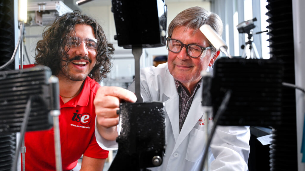 Student, left, and faculty, right, work in the CAMAL lab on NC State's Centennial Campus.
