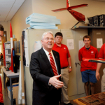 Woodson greets members of the NC State Aerial Robotics Club.