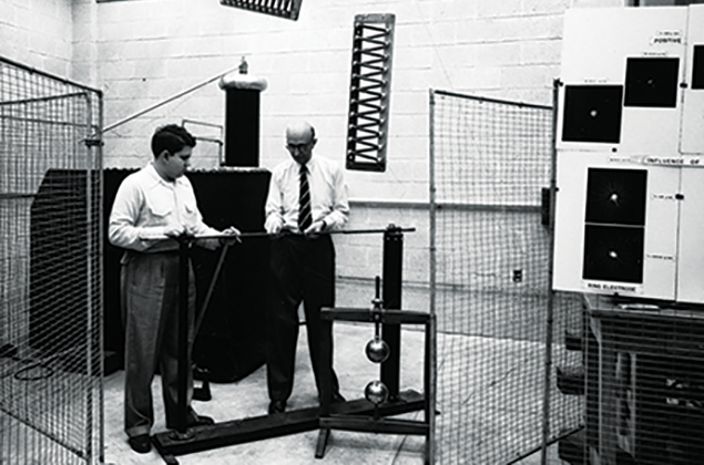 Dr. Wilhelm F. Gauster, professor of electrical engineering, performs a rod-gap experiment with a student in the College’s High Voltage Laboratory in 1952.