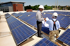 engineers study solar panels