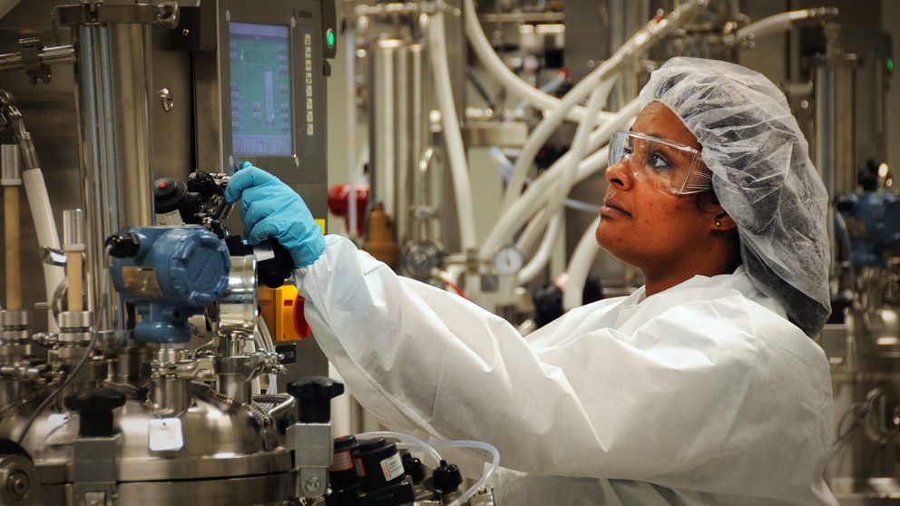 BTEC worker in cleanroom.