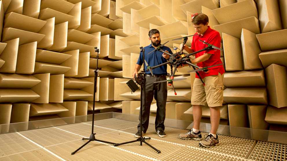 MAE graduate student Thomas Powers, right, works with Woodus (Rocky) Mintz in the anechoic chamber on a multirotor hexacopter that Mintz built. Mintz is the owner of Sandhills Robotics in Fayetteville, NC. In partnership with TFM & Associates, Inc. Sandhills Robotics works with the MAE department on drone research.