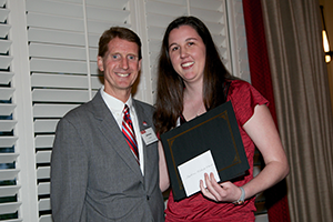 Dr. Lavelle presents the Senior Award for Scholarly Achievement to Stephanie Michaela Rikard.