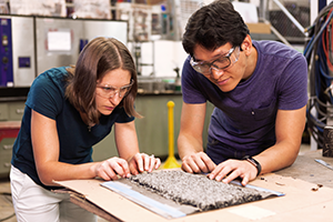 Researchers work in asphalt lab.