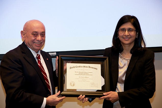 Dr. Louis Martin-Vega, dean of the College of Engineering, presents the 2016 RJ Reynolds Tobacco Company Award for Excellence in Teaching, Research and Extension to Dr. Veena Misra.