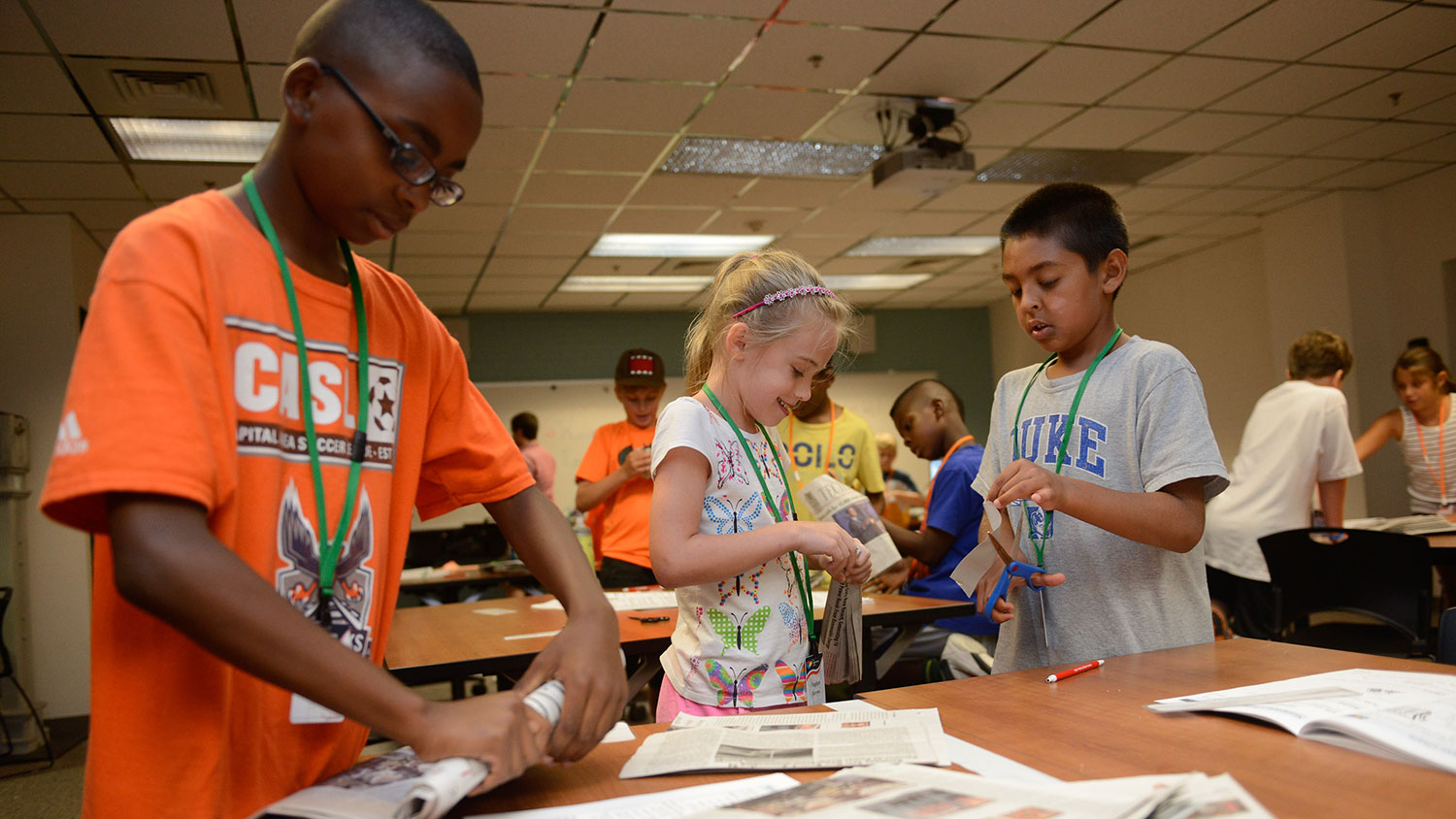 Elementary school campers make furniture from newspapers.