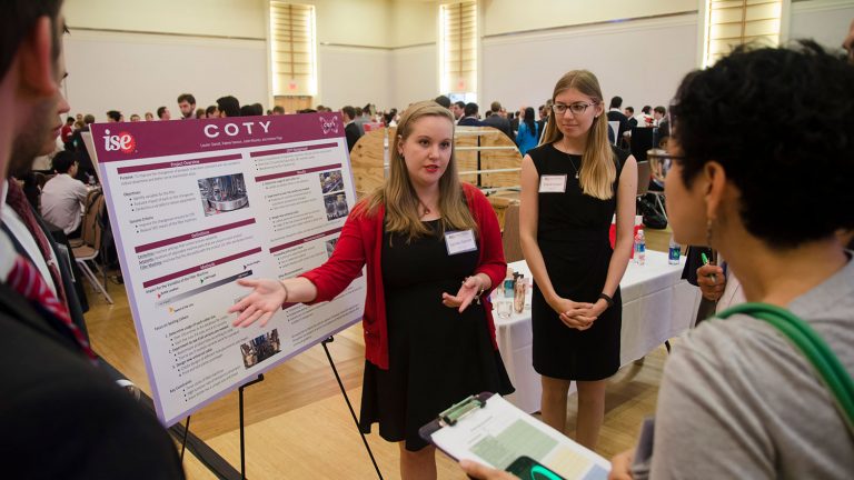 ISE seniors Lauren Garret, left, and Kalene Hanson share their work with Coty with fellow students. (Photo: Robert Lasson, 2017)