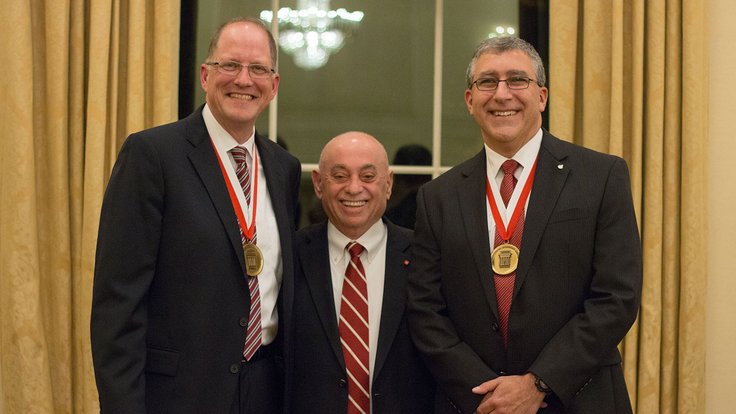 Dr. Louis A. Martin-Vega, dean of the College, recognized 2017 Distinguished Engineering Alumni Hassan and Icenhour at a banquet on Nov. 1.