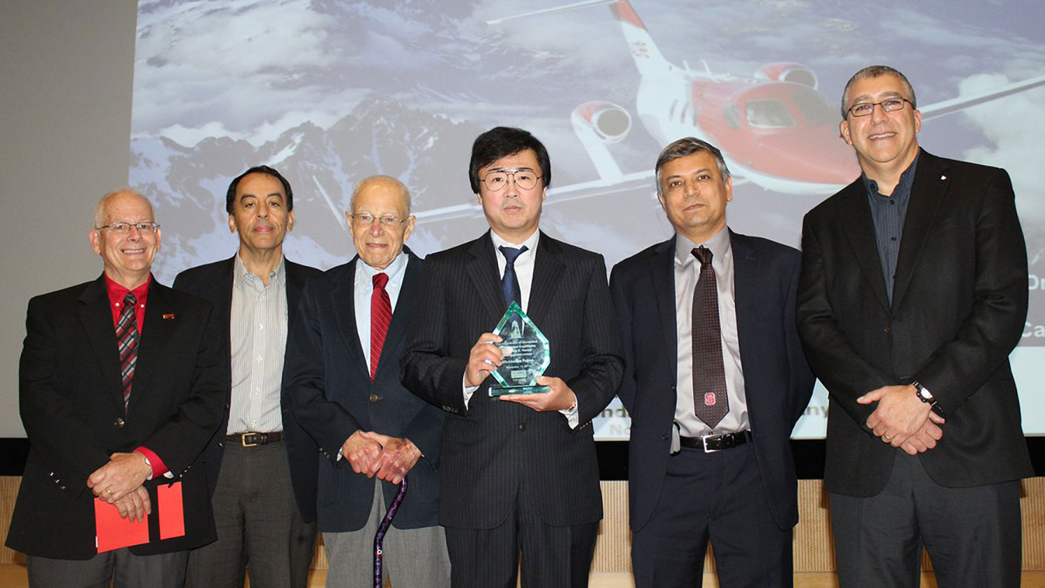 From left, Dr. Richard Gould, RJ Reynolds Professor in the Department of Mechanical and Aerospace Engineering (MAE), Dr. Mohammed Zikry, Zan Prevost Smith Professor in MAE; Dr. Hassan A. Hassan, professor in MAE; Michimasa Fujino; Dr. Srinath Ekkad, professor and department head in MAE; and Dr. Basil Hassan, senior manager at Sandia National Laboratories and son of Dr. Hassan Hassan.