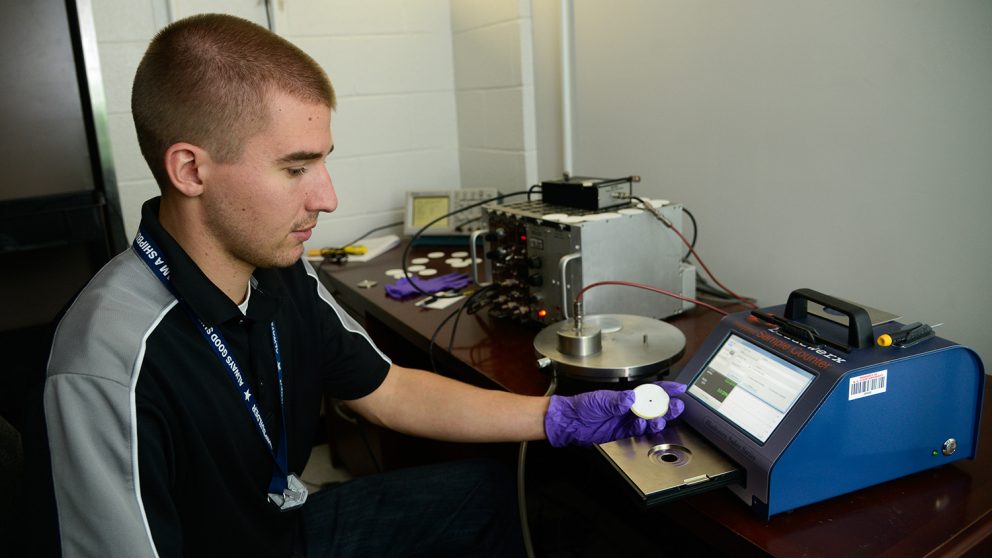 Researcher uses radiation detector.