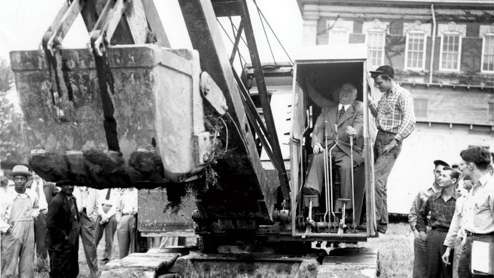 When the College broke ground on Riddick Engineering Laboratories in 1949, Engineering Dean J. Harold Lampe took things a little further, taking a seat in the cab of a steam shovel being used to begin grading work for the project.