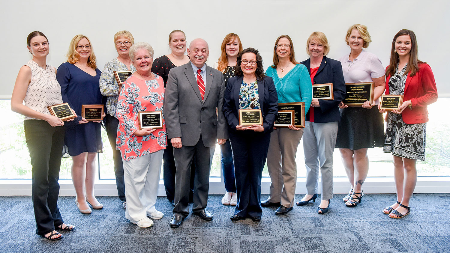 Pictured with Dr. Louis Martin-Vega, dean of the College of Engineering, are Awards for Excellence winners and nominees (l to right): Nicole Hedges, Sherry Bailey, Bonny Downing, Linda Honeycutt, Stefanie Keto, Lauren Jones, Maria Moreno, Susan Bernacki, Joanie Moritz-Smith, Brenda Gainey and Elizabeth Baker.