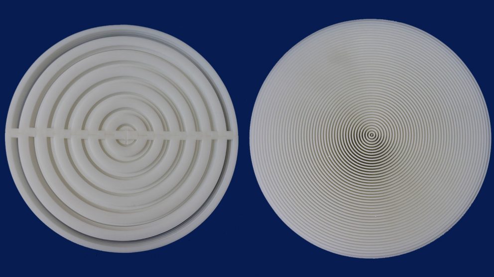 The first layer focuses the incoming sound waves onto a second layer placed behind it, which then sends the sound waves back to their source. The device works by stacking SPI (left) on top of SPII (right).