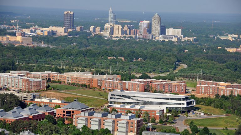 Engineering Oval on Centennial Campus with Raleigh skyscrapers in background
