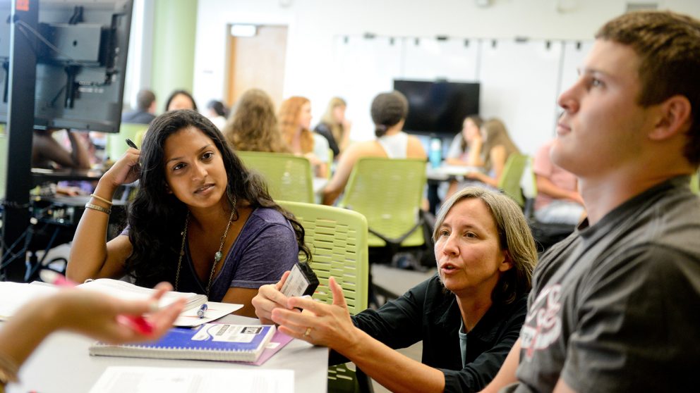 Dr. Jane Lubischer works with students.