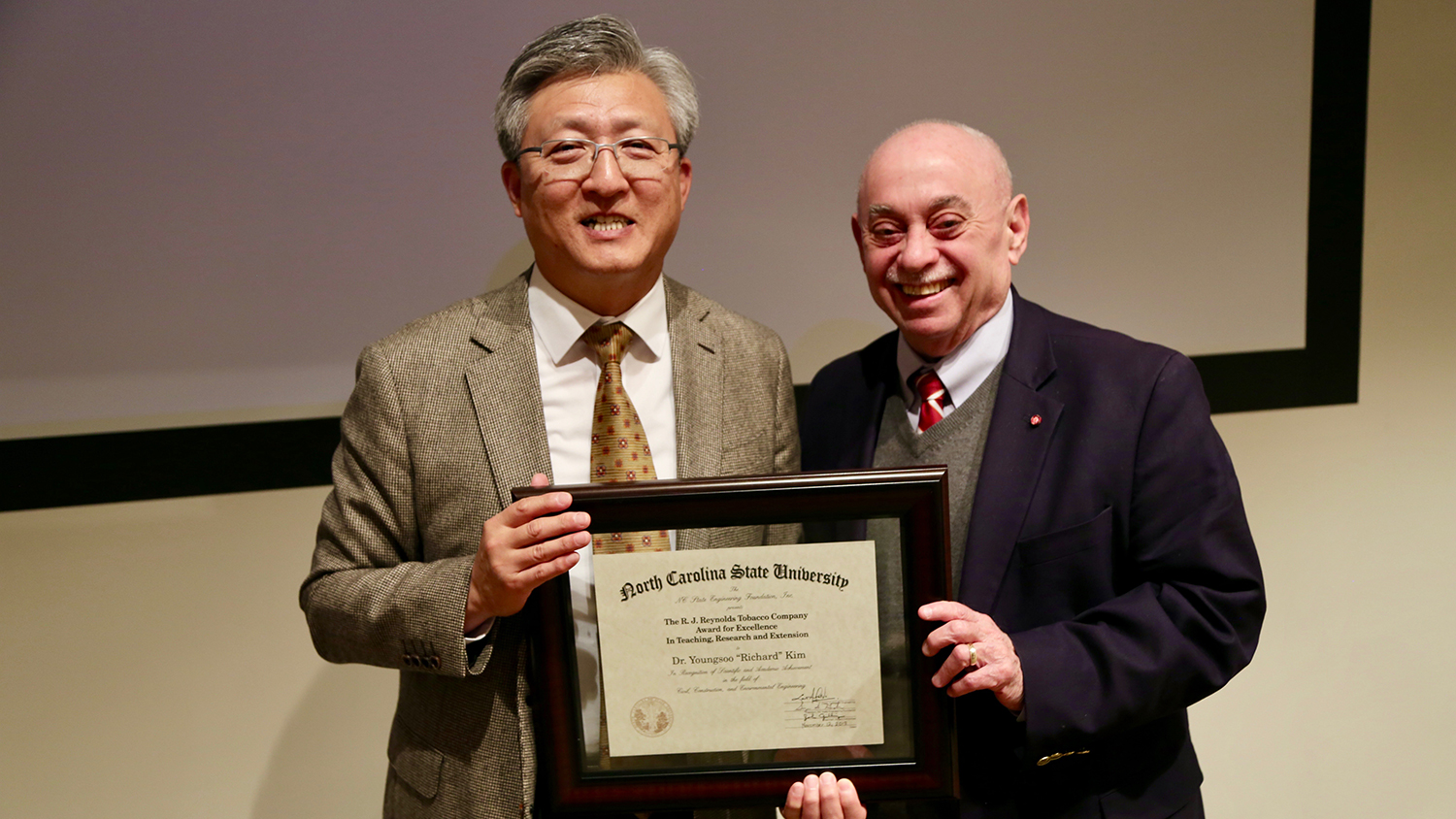 Dr. Youngsoo “Richard” Kim and Dr. Louis Martin-Vega, dean of the College