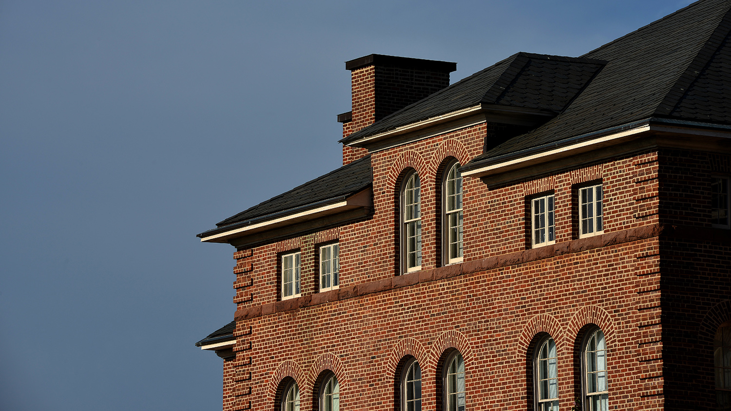 Spring morning sun illuminates Holladay Hall.