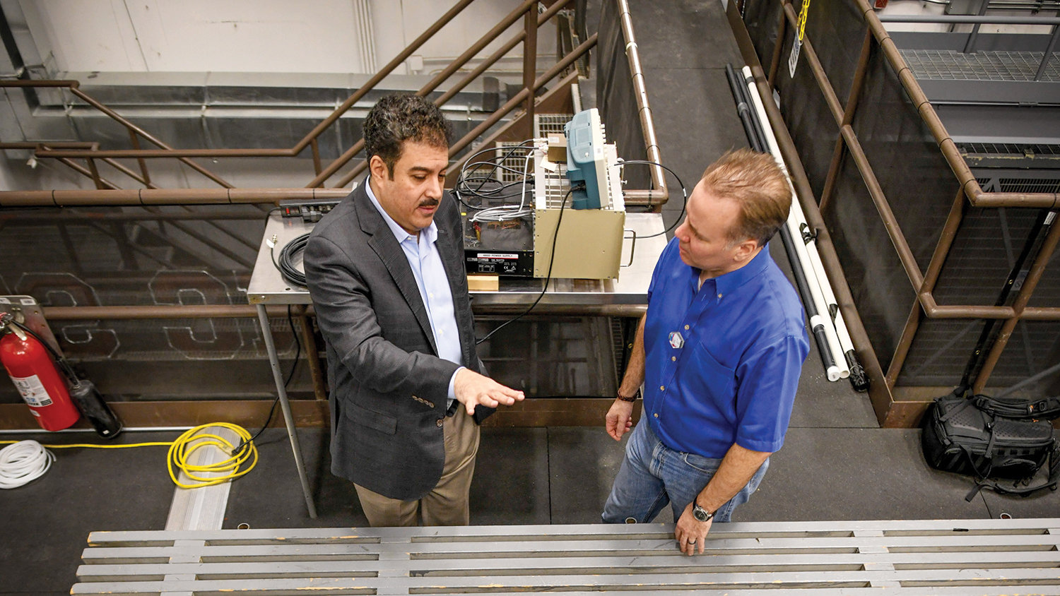 Ayman Hawari (left), distinguished professor of nuclear engineering and director of the NRP, and researcher
