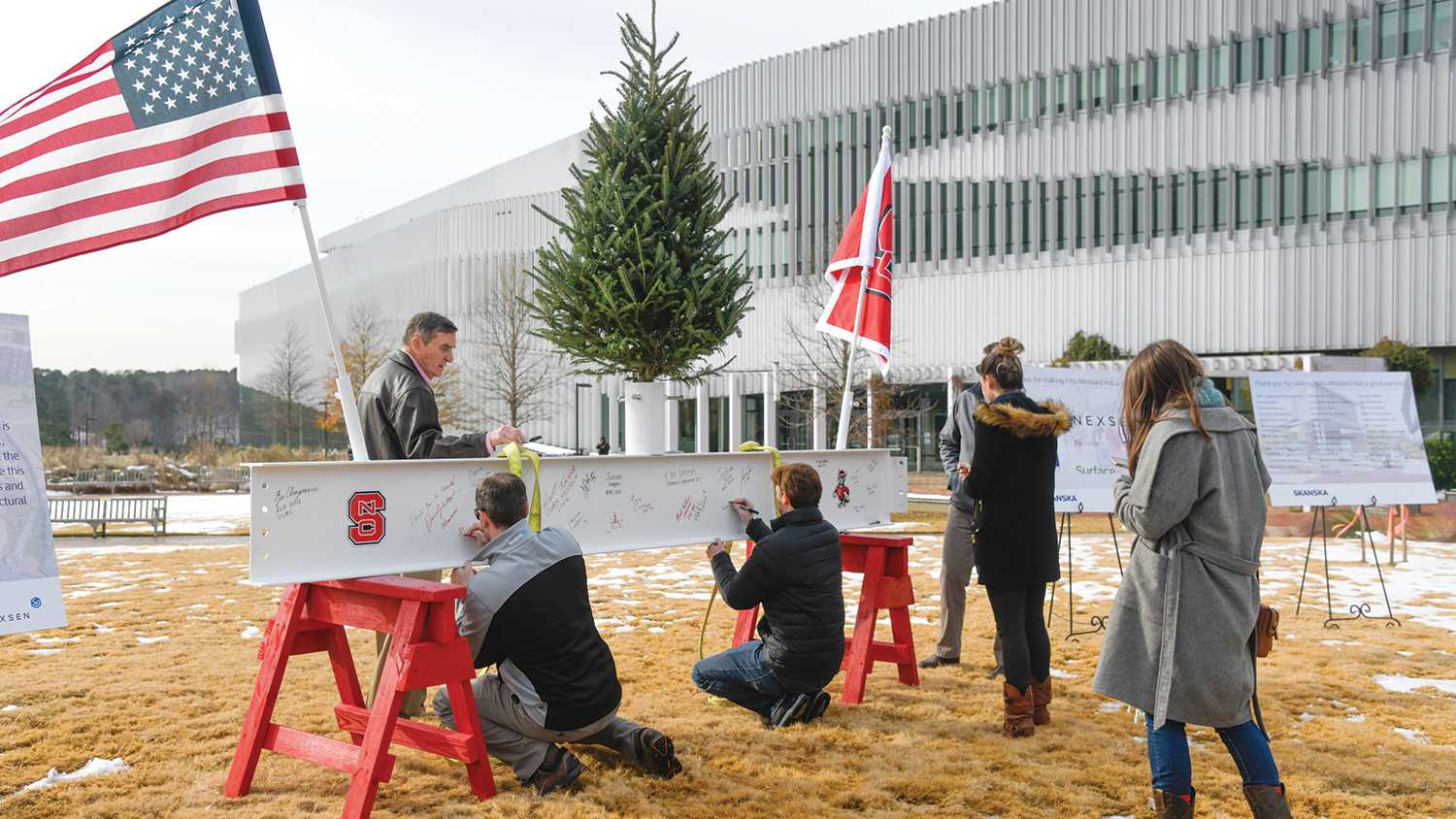 At the Topping Off Celebration, the high beam, which sits at the top of an elevator shaft in the building, was painted white. It was placed on two NC State red saddle horses on the morning of the 12th, and workers and NC State students, faculty and administrators were invited to sign it.