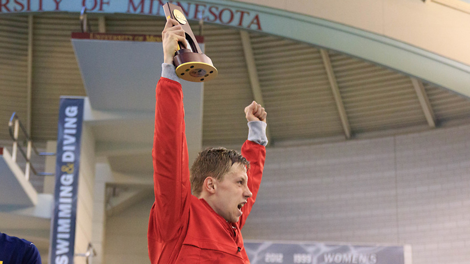 Ipsen holds trophy over his head.