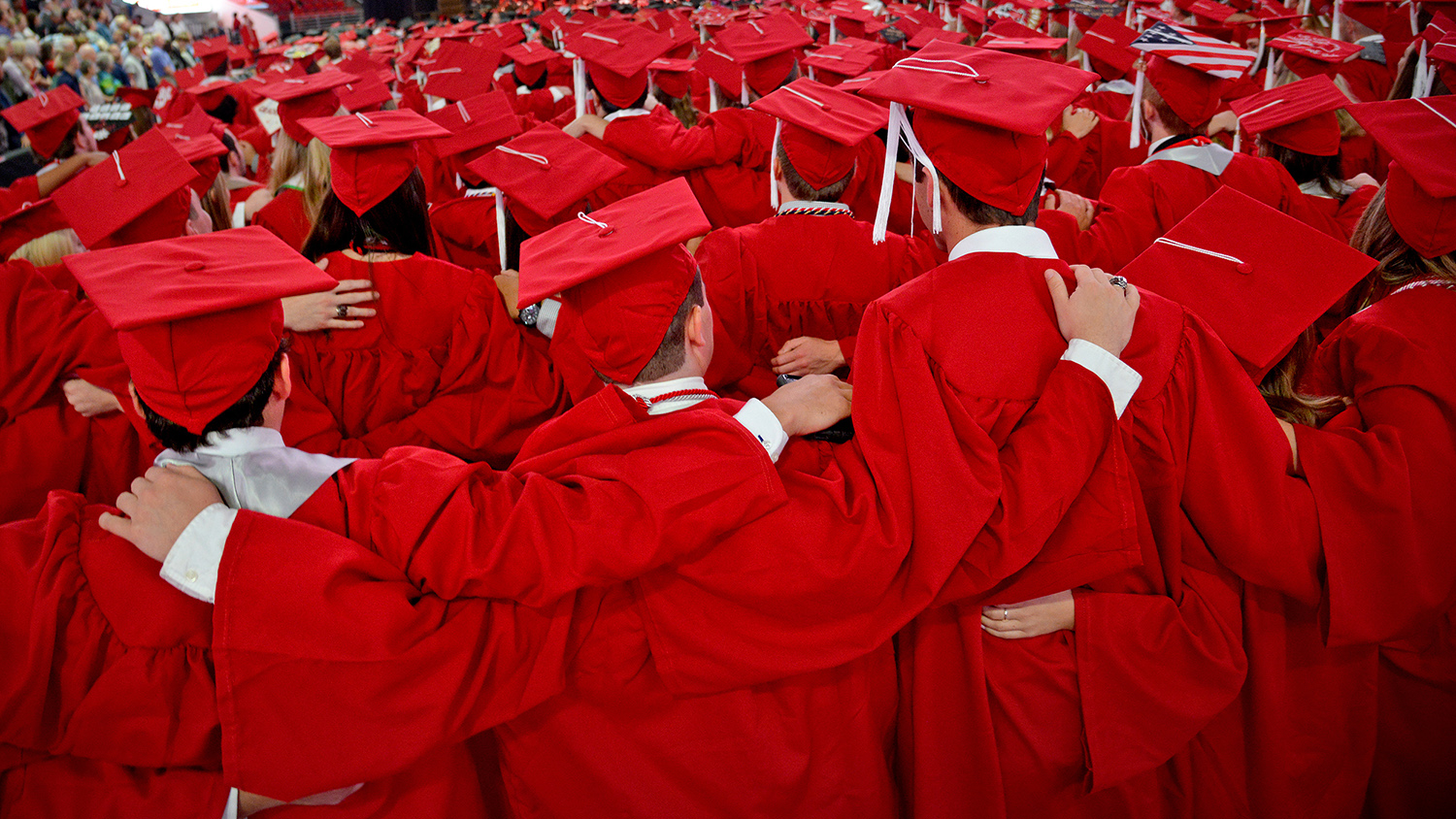 Students sing the Alma Mater at the conclusion of commencement.