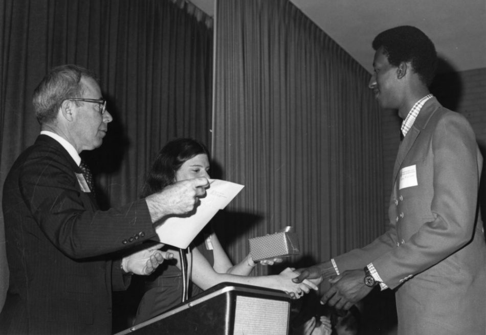 Larry Williams of Elizabeth City (right), chemical engineering senior at NC State University, received the 1978 Outstanding Engineering Citizenship and Service Award during special ceremonies. NC State Dean of Engineering Ralph E. Fadum (far left) presented him with a citation, and President of the Engineers' Council Marcia Sabiston (center) presented him with an engraved watch.