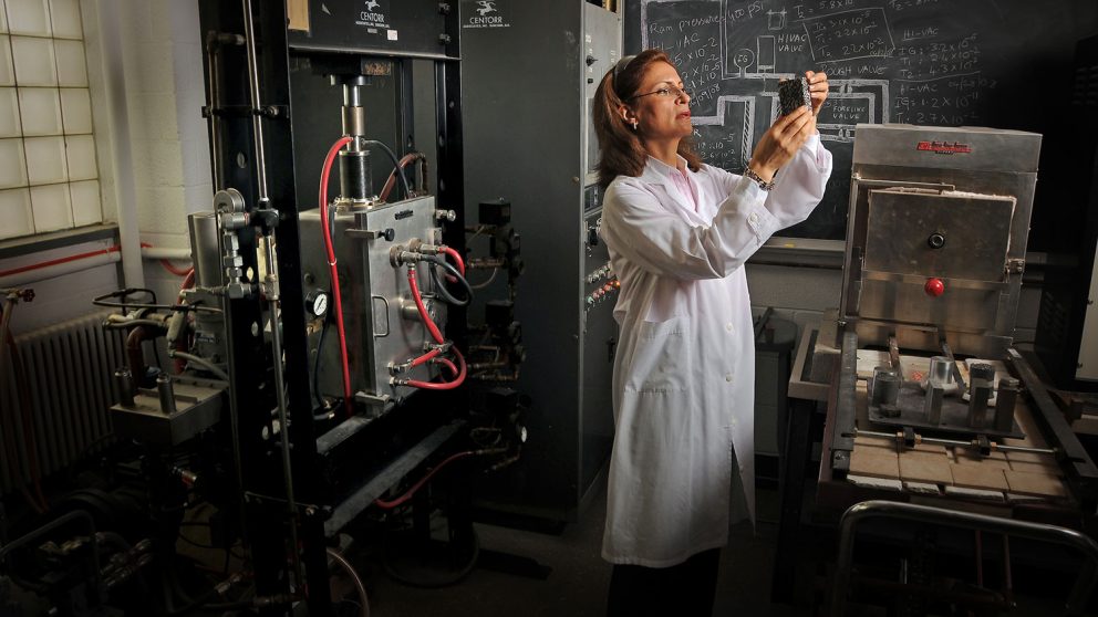 Afsaneh Rabiei checks on metallic foam created in her lab.