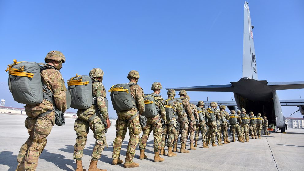 soldiers entering a transport plane