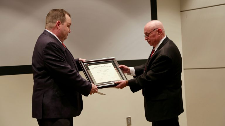 Dean Martin-Vega presents award to Dr. Genzer.
