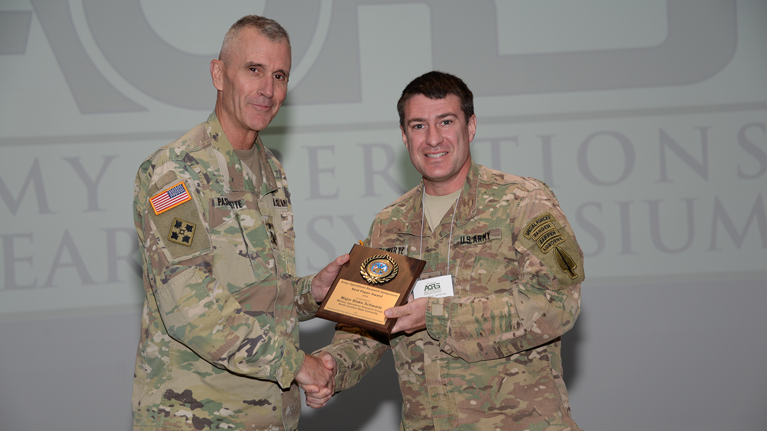 Major Blake Schwartz accepts award.