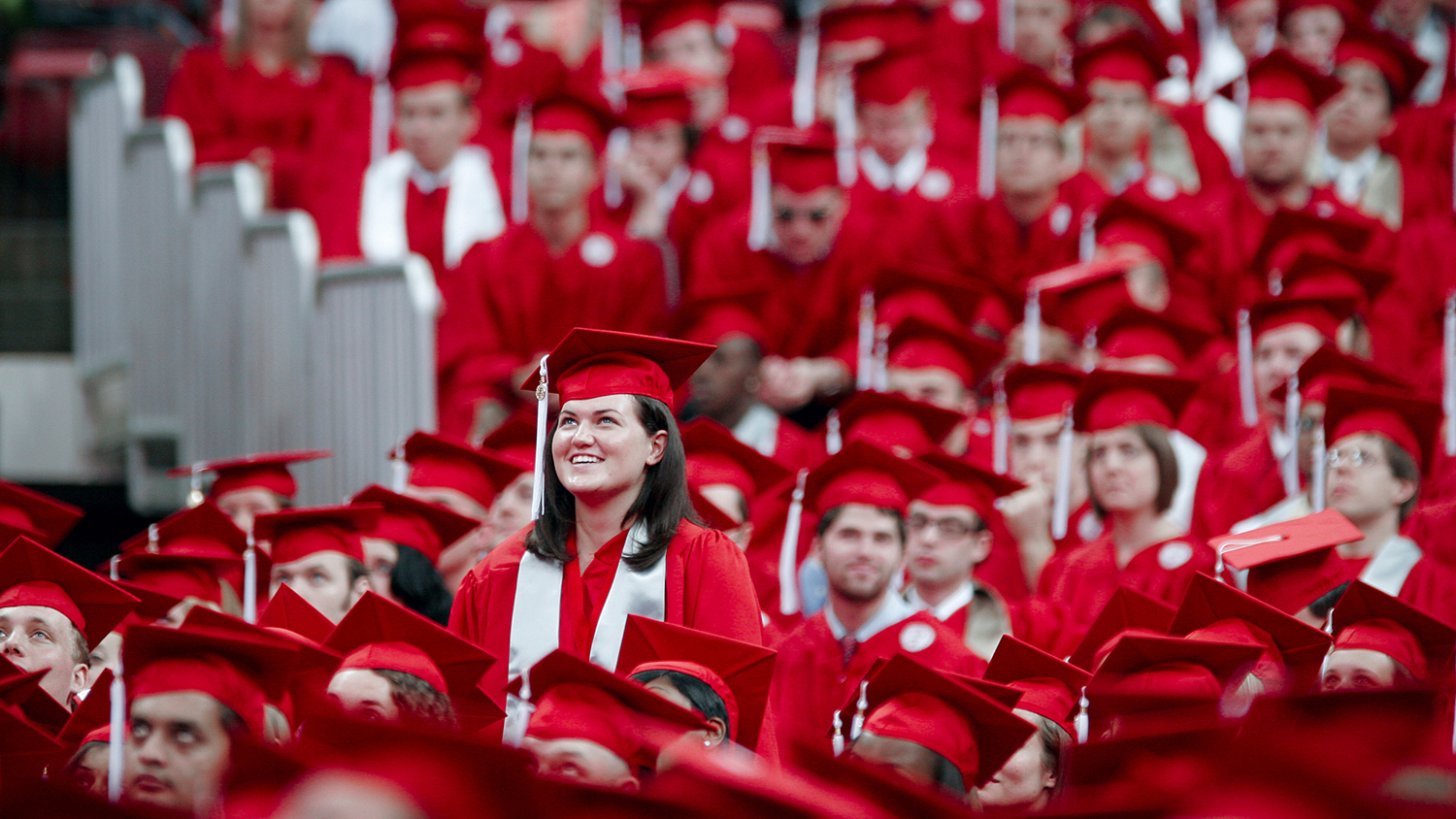 A gathering of graduates in cap and gown