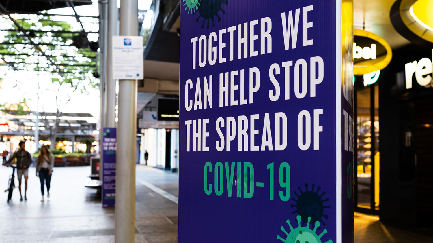 sign reading "together we can help stop the spread of covid-19"
