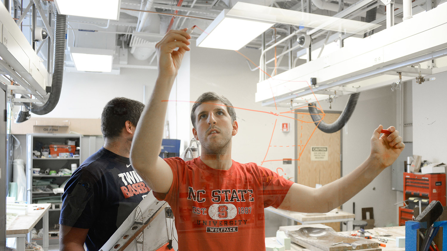 Aerospace engineering students work in a lab