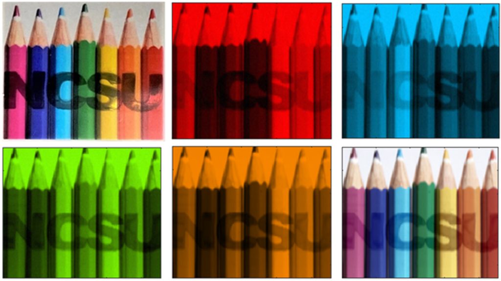 This image shows spectral imaging of a scene containing objects with different colors, as well as the letters NCSU, which contain different polarization states.