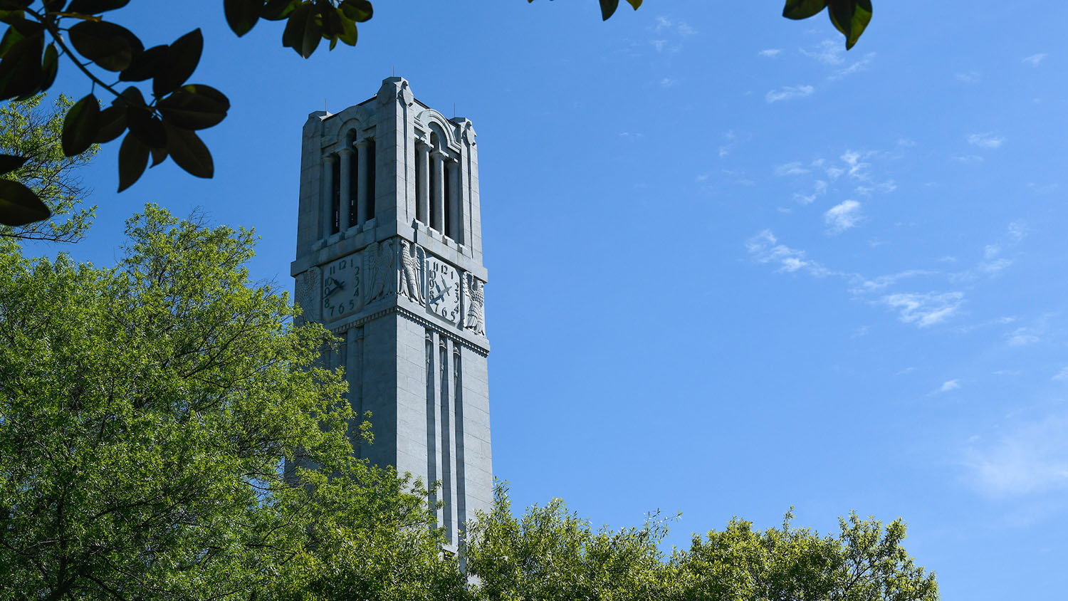 The NC&#160;State belltower, framed against a clear sky.