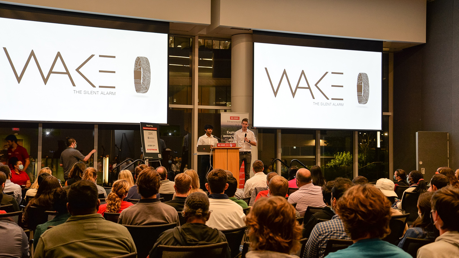 Adarsh Arun and Noah Gassner pitching their venture idea, Wake, at Wolf Den. Wake is a vibrating wristband that only wakes up the one wearing it.