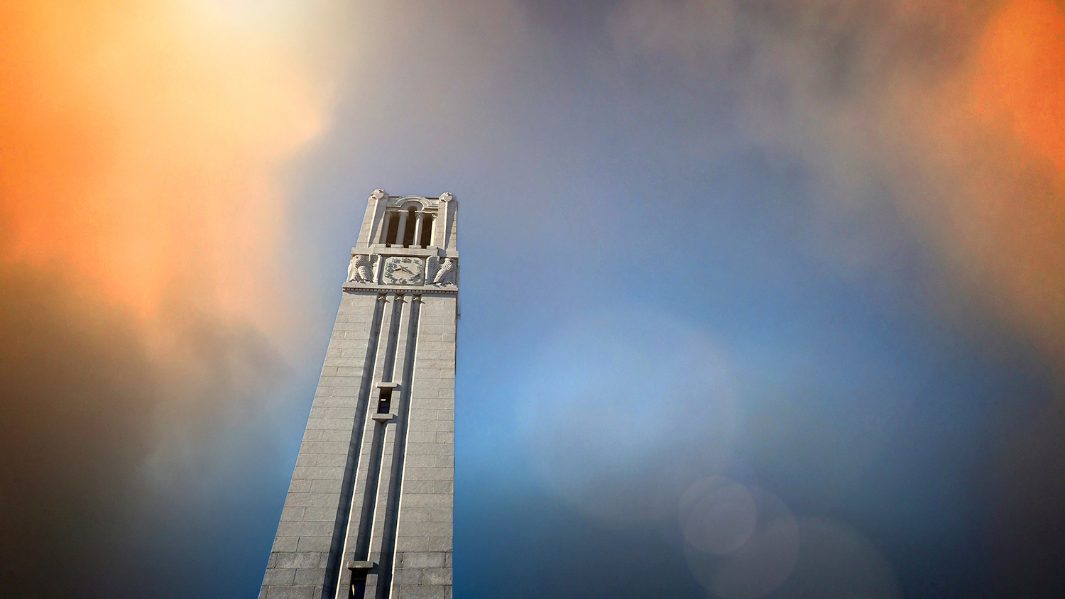 The NC State belltower on main campus at sunset.