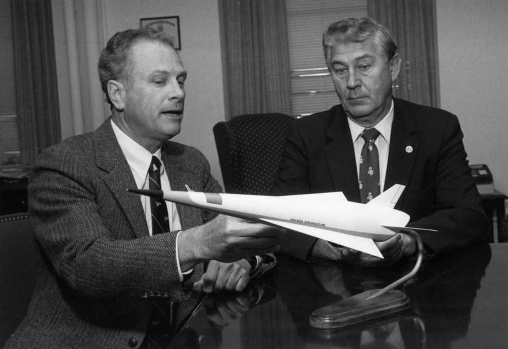 Dr. Fred DeJarnette inspecting a jet model with colleague.