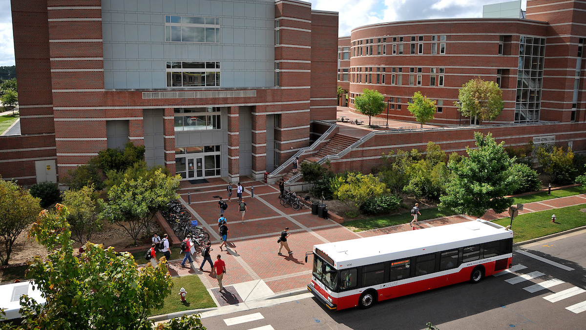 Aerial view of Wolfline bus stopped next to Engineering Building 2 on Centennial Campus.