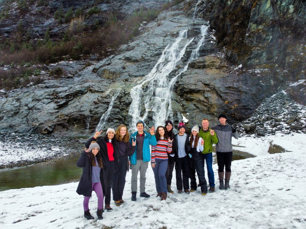 Alex Hsain (center in striped sweater) with her cohort during the 2022 Alternative Spring Break in Hoonah, Alaska