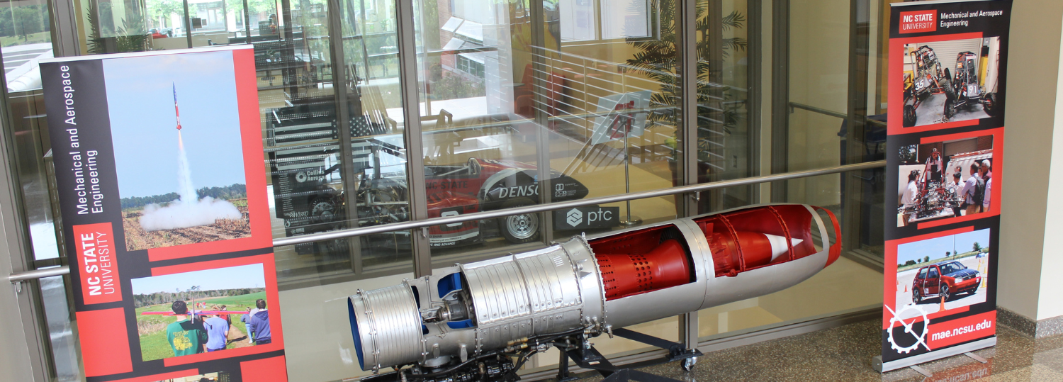 Open cross-section of small rocket on display in the lobby of the Department of Mechanical and Aerospace Engineering.