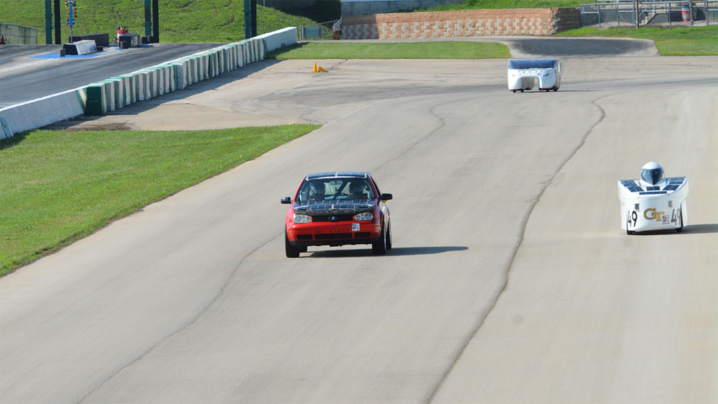 MAE team SolarPack's car, left, in competition with two other cars.