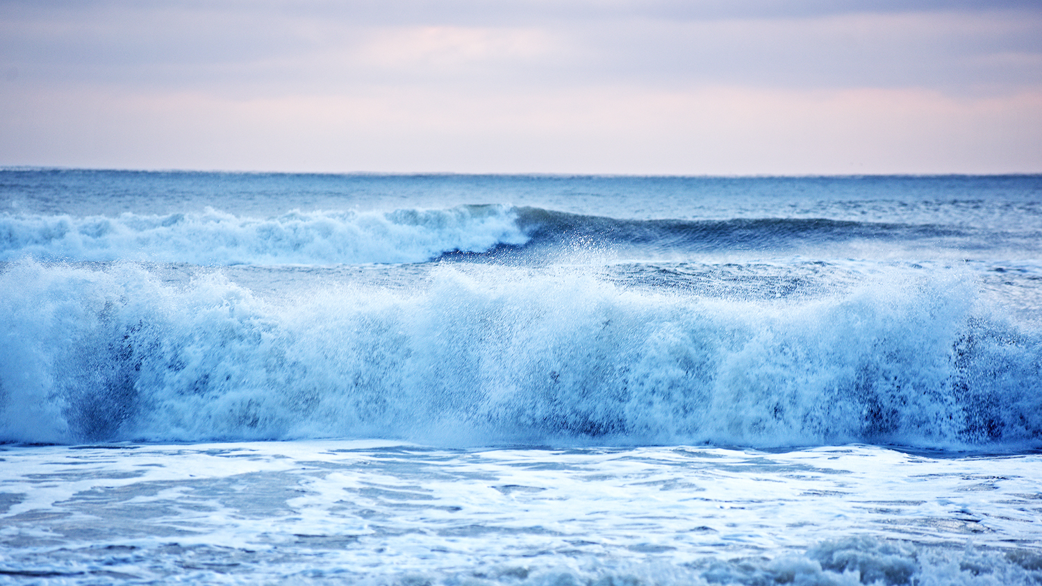 The morning tide crashes on the shoreline at Carova.