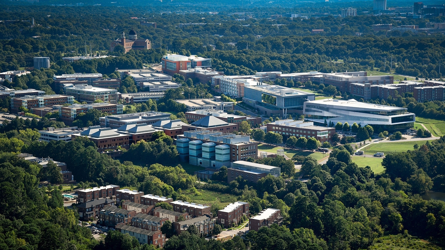 Aerial view of the College of Engineering with Fitts-Woolard Hall in the foreground and Hunt Library to the right.
