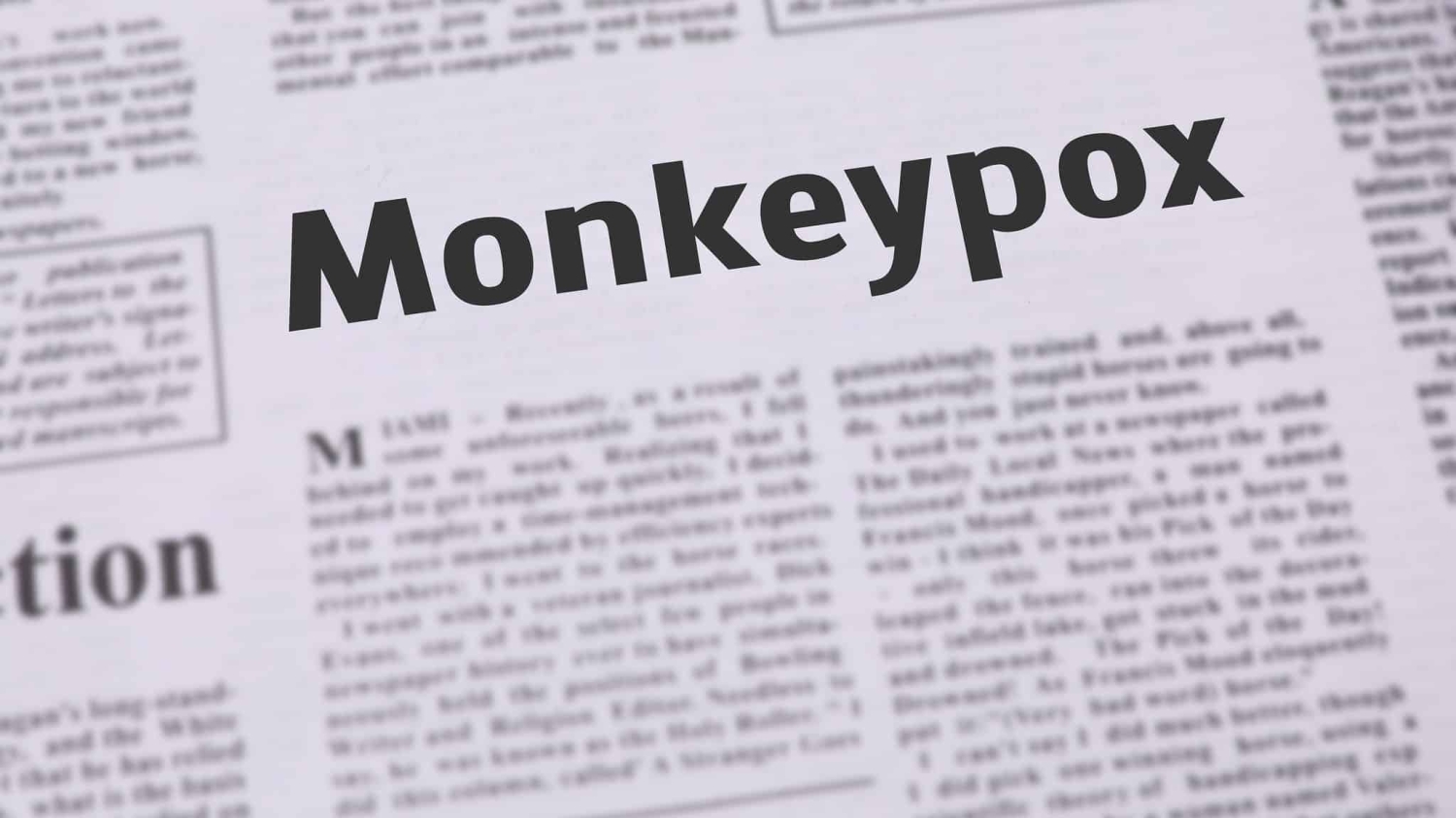 newspaper headline that reads "Monkeypox" - the remainder of the text on the newspaper page is blurred