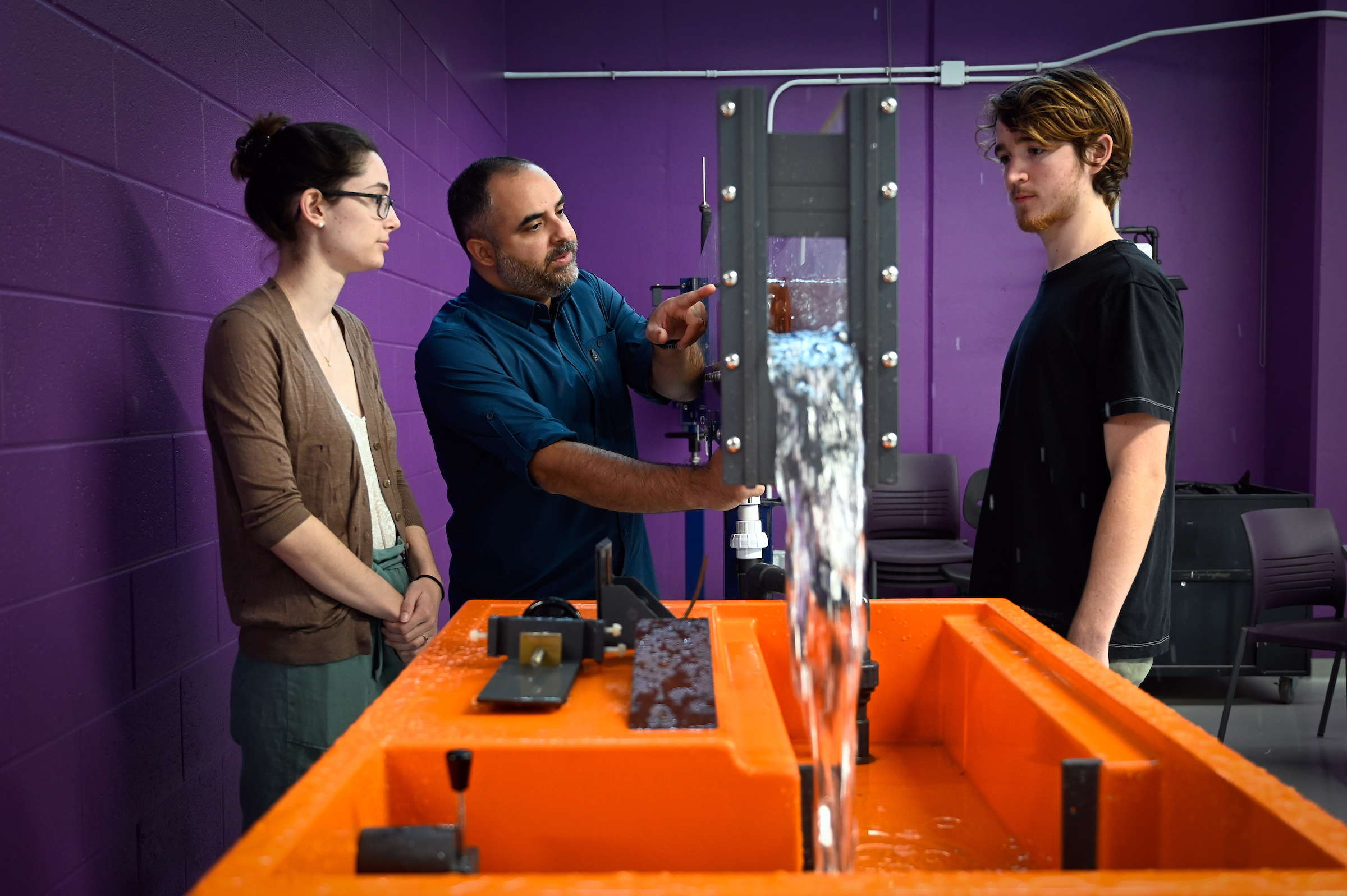 Assistant Professor Tarek Aziz works with a student in the Hydraulics Lab in the Fitts-Woolard building on Centennial Campus.