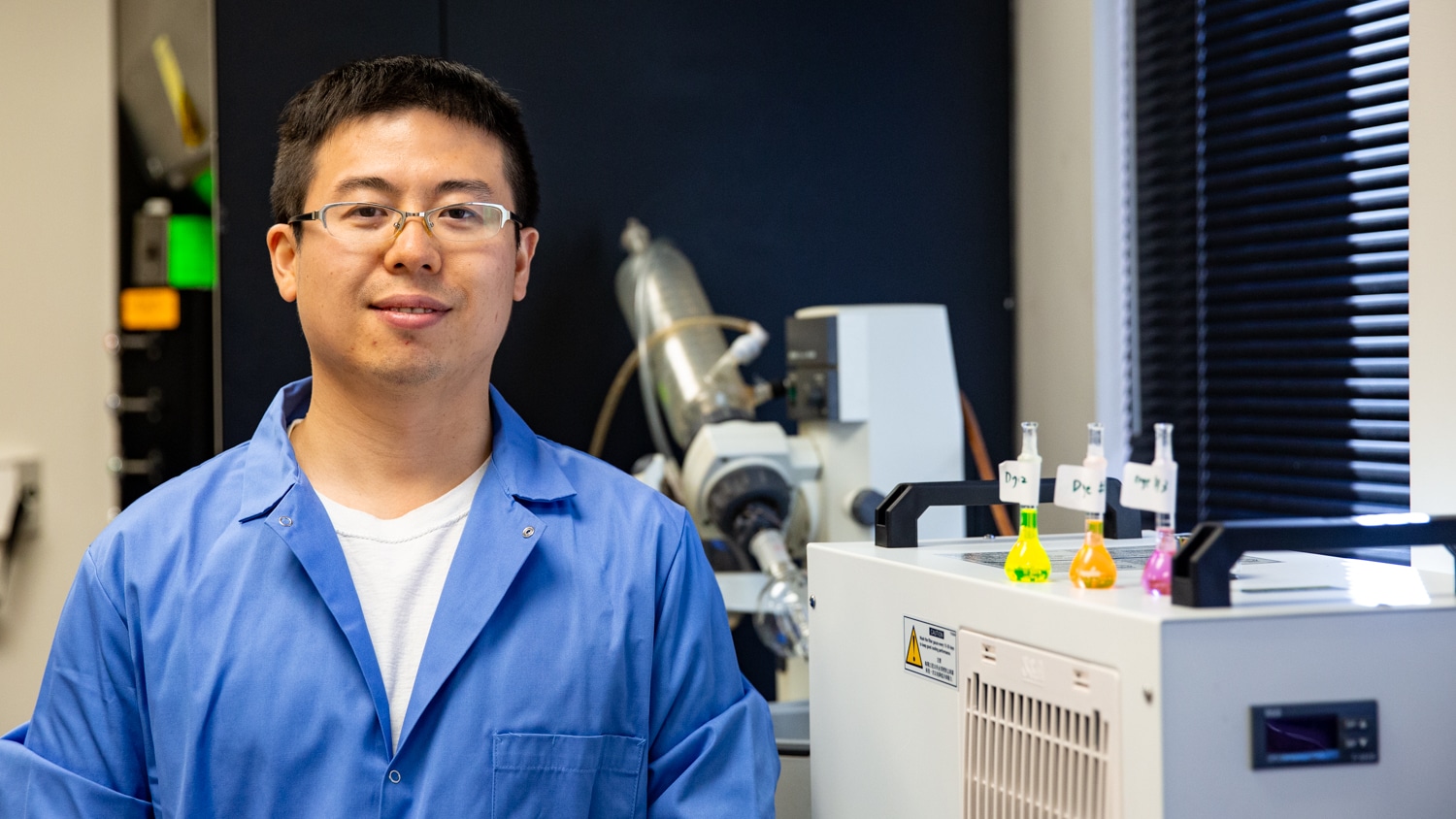 Yang Zhang poses for picture while standng in his laboratory.