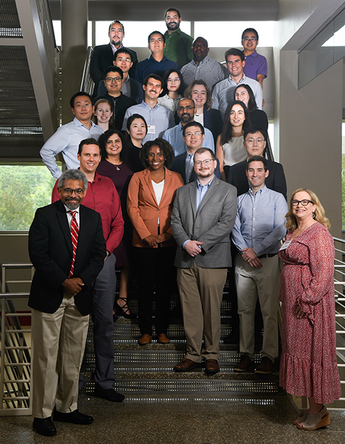 2022-23 new faculty members pose together for a group photo.