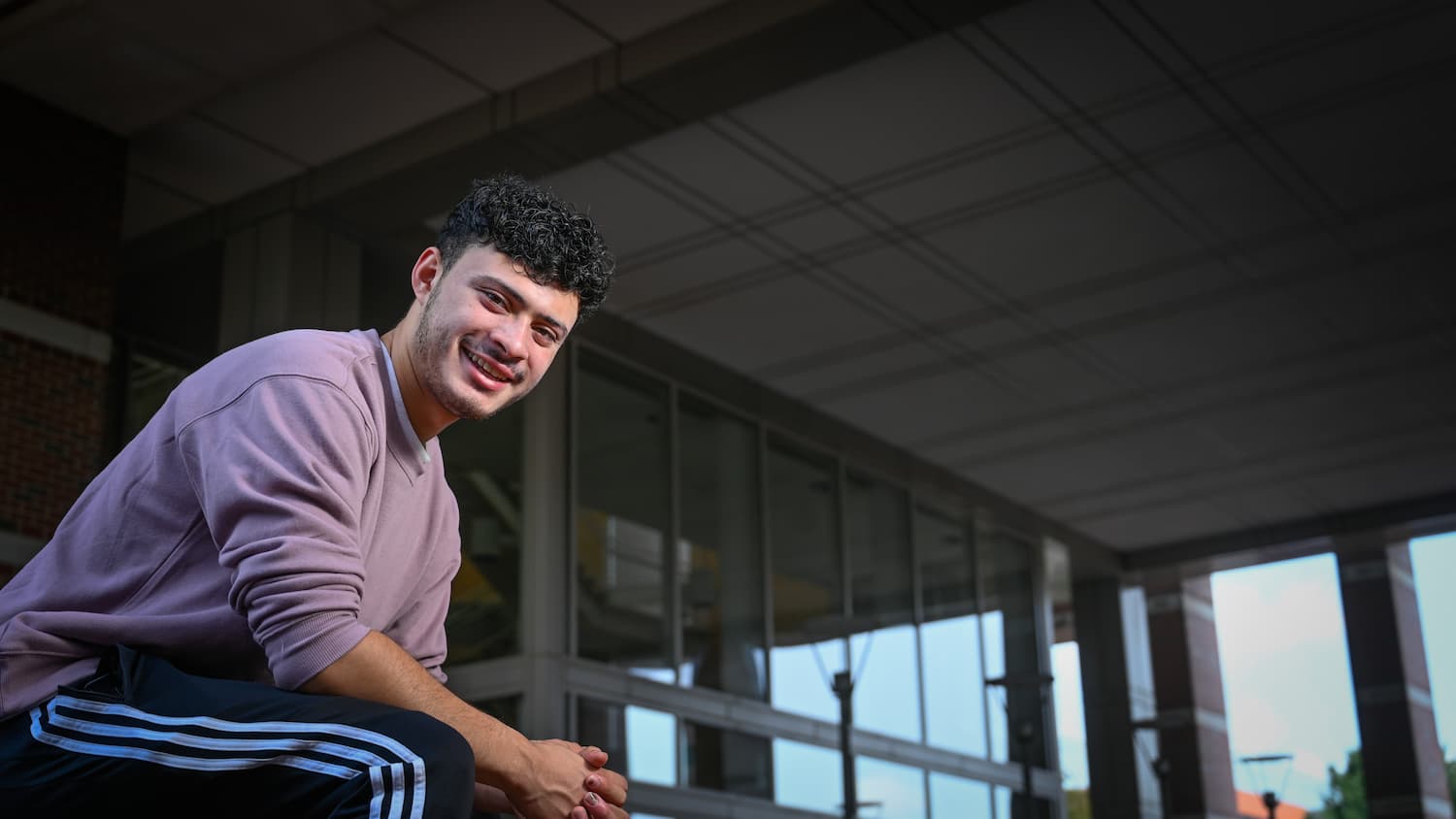 Michael Nuñez sits outside one of the buildings on Centennial Campus.