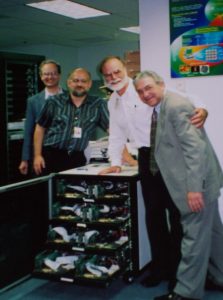 Fischer, left, with the first Beowulf at NASA Goddard Space Flight Center in 1994.